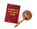 Domestic violence law book and wooden gavel on background, top view Royalty Free Stock Photo