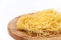 Domestic yellow noodles on a kitchen board