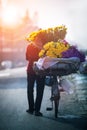 domiestic life photography of vietnamese woman and selling flower bicycle in hanoi city