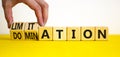 Domination or limitation symbol. Businessman turns cubes, changes the word domination to limitation. Beautiful yellow table, white