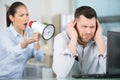 domineering female boss shouting at male office worker Royalty Free Stock Photo