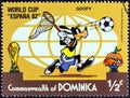 DOMINICA - CIRCA 1982: A stamp printed in Dominica shows Goofy chasing ball with butterfly net, circa 1982.