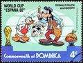 DOMINICA - CIRCA 1982: A stamp printed in Dominica shows Donald Duck and Goofy as park attendant, circa 1982. Royalty Free Stock Photo