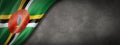 Dominica flag on concrete wall banner Royalty Free Stock Photo