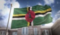 Dominica Flag 3D Rendering on Blue Sky Building Background