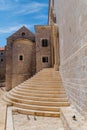 Dominican Monastery`s architectural features with curved steps entrance