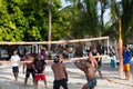 Group young friends playing volleyball on beach Royalty Free Stock Photo