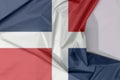 Dominican Republic fabric flag crepe and crease with white space.
