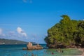 Dominican Republic. 20 NOVEMBER 2021. Caribbean beach with a lot of palms and white sand, sunbeds. Sunny warm day at the sea under Royalty Free Stock Photo