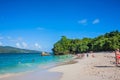 Dominican Republic. 20 NOVEMBER 2021. Caribbean beach with a lot of palms and white sand, sunbeds. Sunny warm day at the sea under Royalty Free Stock Photo