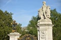 Dominion Gates in London, This gates exists of two stone columns topped with ornate figurative sculptures of a boy and the coat of