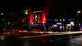 The Dominion Theatre in London at night on Oxford Street