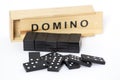 Domino game box and pieces on white background Royalty Free Stock Photo