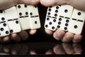 Domino bones in the hands
