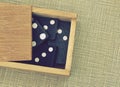 Domino in a box Royalty Free Stock Photo