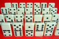 Domino,dominos in a row and red background Royalty Free Stock Photo