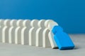 Domino effect in business. One businessman leader falls and brings down other figures of employees. System disruption