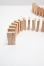 Domino effect - row of white dominoes on white background Royalty Free Stock Photo