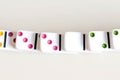 Domino effect shot. Look down for domino game. Dominoes falling in a row in front. Dominoes Game Pieces Isolated on Royalty Free Stock Photo