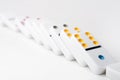 The domino effect of white blocks, with colorful numbers. Selective focus on the front part of the domino blocks. Royalty Free Stock Photo