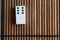 Domino piece on the bamboo brown wooden table background. Domino set empty - 6 dots. Royalty Free Stock Photo