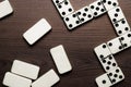 Domino pieces on the wooden table background