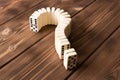 Domino question mark on wooden table. Domino principle Royalty Free Stock Photo