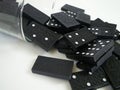 Black and White Dominoes Falling From a Vase Isolated