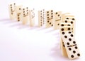 Dominoes falling down Royalty Free Stock Photo