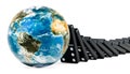 Dominoes tiles falling on to the Earth Globe, 3D rendering Royalty Free Stock Photo