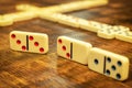 Dominoes tiles on vintage table Royalty Free Stock Photo