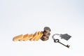 Dominoes with unstable coin stack on white background, financial crisis concept