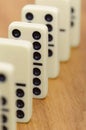 Dominoes on wooden surface abreast Royalty Free Stock Photo