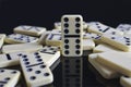 Dominos fallen around a double six Royalty Free Stock Photo