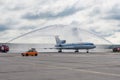 Domodedovo airport, Moscow - July 11th, 2015: Tupolev Tu-154M EW-85748 of Belavia Airlines greeted by water arch