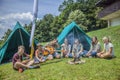 DOMZALE, SLOVENIA - Jul 16, 2019: Sitting around a fire and singing songs