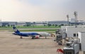 Don-Mueang International Airport view, Airplane parking at passenger gate, connect to gate with jet bridge