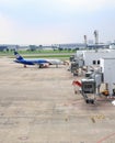 Don-Mueang International Airport view, Airplane parking at passenger gate, connect to gate with jet bridge