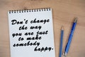 Don`t change the way you are, just to make somebody happy words on notebook