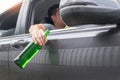 Don`t Drink for Drive concept, Young Drunk man drinking bottle of beer or alcohol during driving the car dangerously Royalty Free Stock Photo