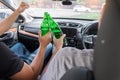 Don`t Drink for Drive concept, Young Drunk man drinking bottle of beer or alcohol during driving the car dangerously Royalty Free Stock Photo