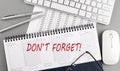 Don`t Forget Notice Reminder words on planner with keyboard