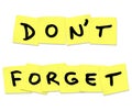 Don't Forget Reminder Words on Yellow Sticky Notes Royalty Free Stock Photo