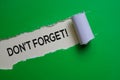 Don`t Forget Text written in torn paper