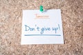 Don't Give Up Reminder For Tomorrow On Paper Pinned On Cork Board