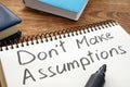 Dont Make Assumptions. Notepad with marker on a table Royalty Free Stock Photo