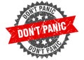 Don`t panic stamp. grunge round sign with ribbon Royalty Free Stock Photo