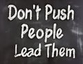 Don\'t Push People Lead Them - inspirational quote writen on a blackboard Royalty Free Stock Photo