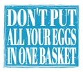 DON`T PUT ALL YOUR EGGS IN ONE BASKET, text on blue stamp sign Royalty Free Stock Photo