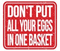 DON`T PUT ALL YOUR EGGS IN ONE BASKET, words on red stamp sign Royalty Free Stock Photo